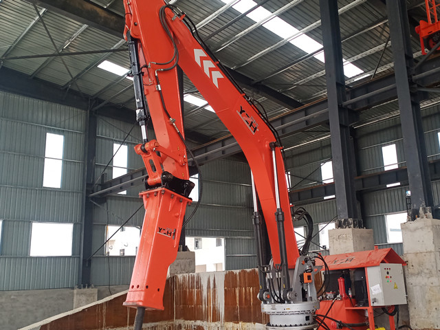 Stationary rockbreaker boom system