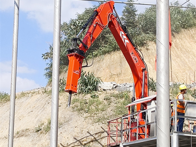 stationary rockbreaker boom system